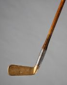 A rare George Bussey, London, patent steel socket putter circa 1895, brass head, hickory shaft,