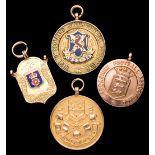 Four 9ct. gold football medals, a cased Lancashire F.A.