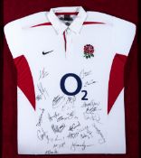 Framed signed England rugby shirt circa 2004, signed by a post World Cup England team,