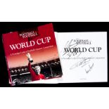 A World Cup book signed to the dust jacket by Nelson Mandela and inside by a fine selection of