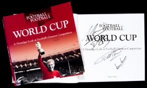 A World Cup book signed to the dust jacket by Nelson Mandela and inside by a fine selection of