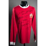 A signed red Manchester United 1968 retro jersey,