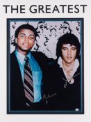 A Muhammad Ali signed large framed colour photograph of the boxer with Elvis Presley, 20 by 16in.