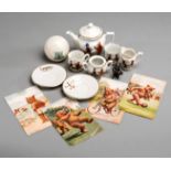 A china nurseryware tea set featuring sports,