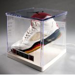 A Michael Jordan signed Nike Air Jordan basketball shoe, white & black with red interior,