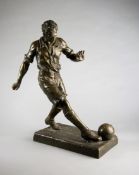 An unusually large spelter figure of a footballer, signed Ruffony and stamped FRANCE to the base,