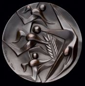 A 1964 Tokyo Olympic Games participation medal, designed by T. Okamoto and K.