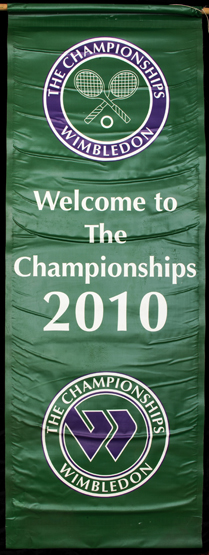 A large "Welcome" banner from the 2010 Wimbledon Lawn Tennis Championships, printed on green vinyl,