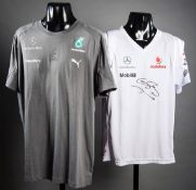 T-shirts signed by the British F1 World Champions Lewis Hamilton & Jenson Button,