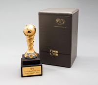 A fine quality cased miniature replica of the FIFA Confederations Cup Korea/Japan 2001 Trophy,