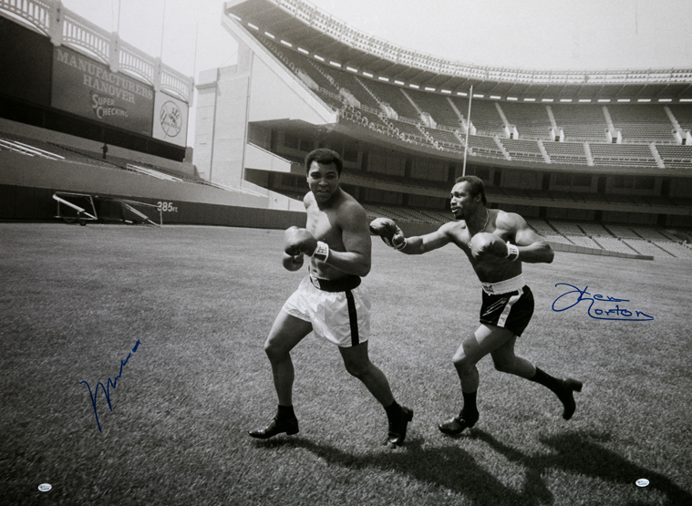 A large and impressive photograph double-signed by Muhammad Ali and Ken Norton, 30 by 40in.