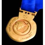 Salt Lake City 2002 Winter Olympic Games gold winner's prize medal awarded to a member of the