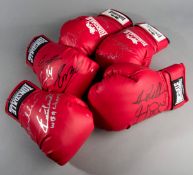 A group of five autographed red Lonsdale boxing gloves,