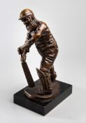 A bronze figure of W. G.