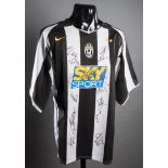 Team-signed Juventus replica jersey, signed in black marker pen by Buffon, Thuram, Trezeguet,