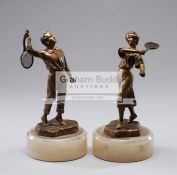 A pair of gilt-bronze figures of tennis players circa 1900, signed H.