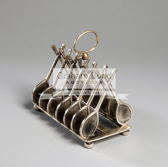 A silver plated tennis theme novelty toast rack circa 1900,