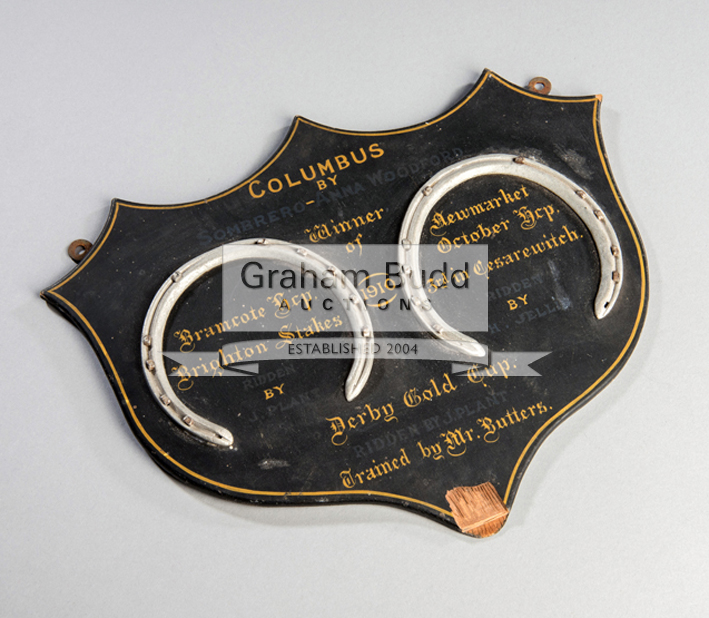 A pair of mounted racing plates commemorating victories of the racehorse Columbus in 1910,