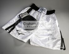 Mike Tyson signed boxing glove and trunks,