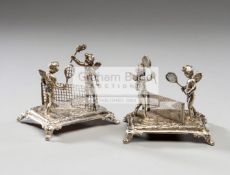 Pair of Edwardian silver menu holders with a design of cherubs playing tennis,