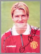 Signed colour photograph of Manchester United legend David Beckham, signed in marker pen, 10 by 8in.
