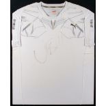 Usain Bolt signed Puma running vest, signed in marker pen, framed & glazed, 75 by 62cm.