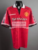 Manchester United replica jersey signed by 17 members of the 1999 Treble winning team,
