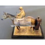 A circa 1920s cold painted metal Perpetual Match Lighter in the form of a horse and jockey,