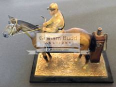 A circa 1920s cold painted metal Perpetual Match Lighter in the form of a horse and jockey,