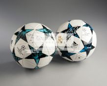 Lionel Messi and Cristiano Ronaldo signed footballs,