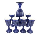 An Iden Pottery of Rye, Sussex violet glazed wine decanter and stopper with six matching goblets.