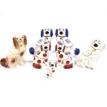 A collection of ceramic spaniel dogs.