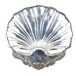 A large Mexican sterling silver tray. Of scallop shell form supported on three shell feet.