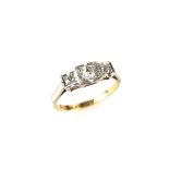 18 ct yellow gold and platinum three stone diamond ring. Set with three graduated old cut diamonds.