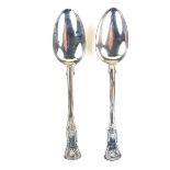Two silver Kings pattern serving spoons.