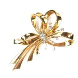 18 ct yellow gold diamond bow brooch.