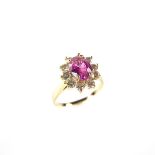 14 ct yellow gold pink sapphire and diamond ring. The oval cut pink sapphire weighing approx. 1.