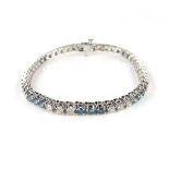 14 ct white gold blue and white diamond tennis bracelet.