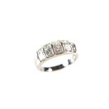 18 ct white gold diamond half eternity ring. Set with ten graduated princess cut diamonds.