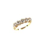 18 ct yellow gold five stone diamond ring. Set with five graduated circular cut diamonds.