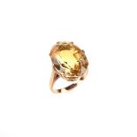 Yellow gold citrine ring. The oval cut honey coloured citrine weighing approx. 9.62 ct. Ring size M.