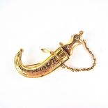 Yellow gold khanjar dagger brooch. Designed as an Omani khanjar dagger complete with scabbard.