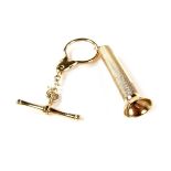 A 9ct yellow gold cigar piercer and key ring.