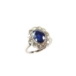 18 ct white gold and platinum sapphire and diamond ring. The oval cut sapphire weighing approx. 2.