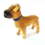 A Steiff boxer dog. With original tagged button. 8.7 in (22 cm) length.