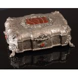 Silver trinket box with carnelian cabochons.