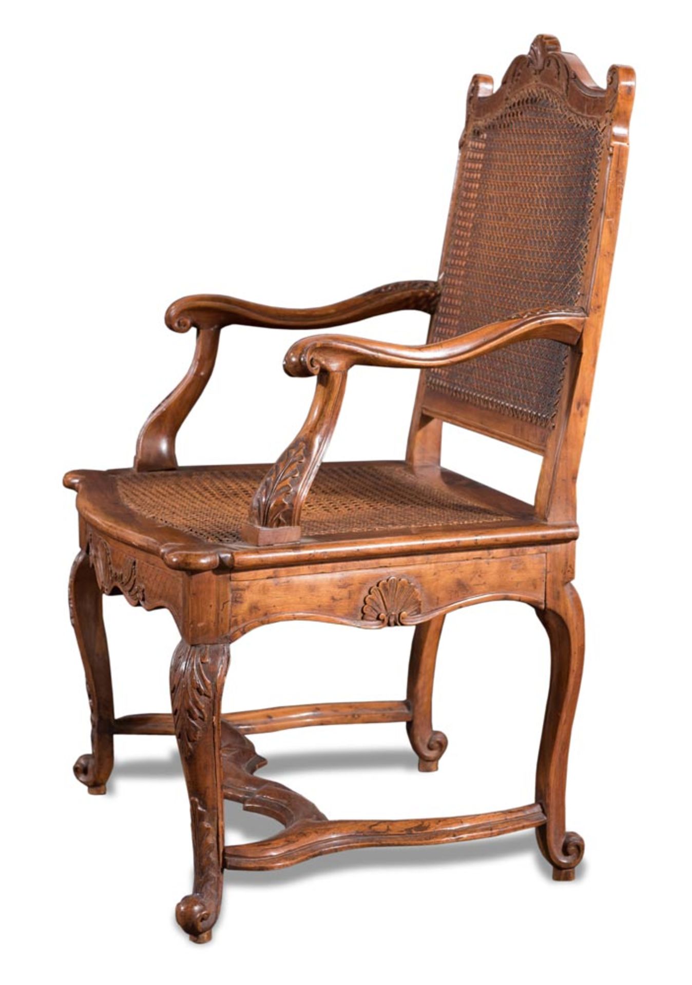 Carved walnut fauteuils with caned back and seat, X18th Century.
