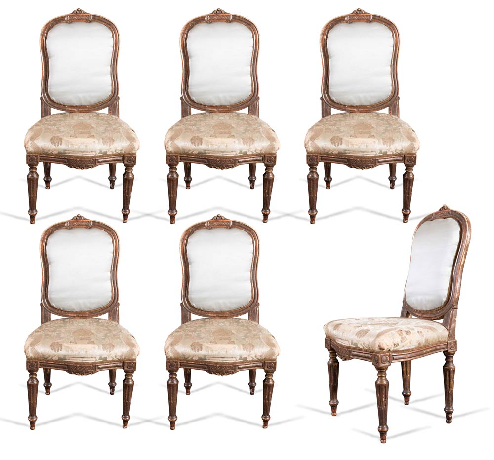 Set of six carved and gilt wood chairs, end of 18th Century.