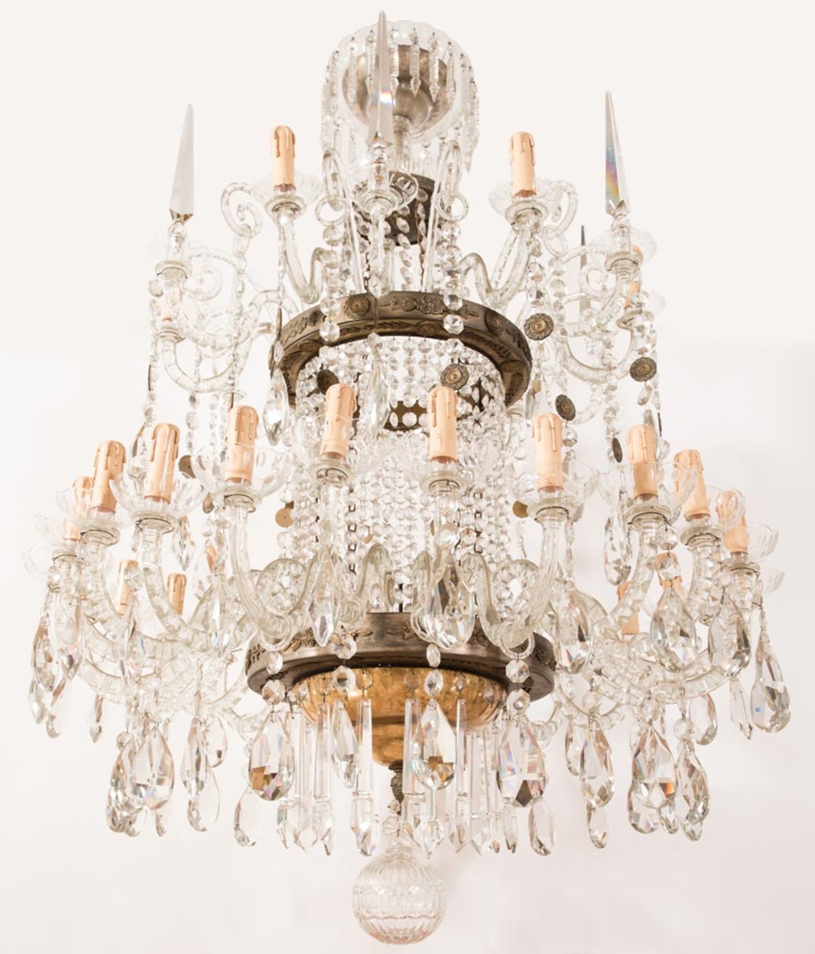 Crystal chandelier with thirty arms and with faceted drops.