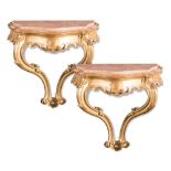 Pair of carved and gilt wood consoles with pink marble top, 20th Century.